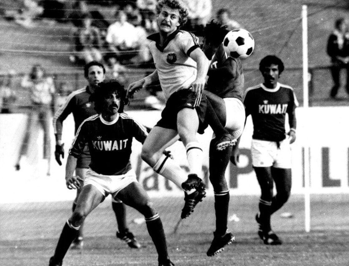 Peter Stone challenging for a header against Kuwait in a World Cup qualifier