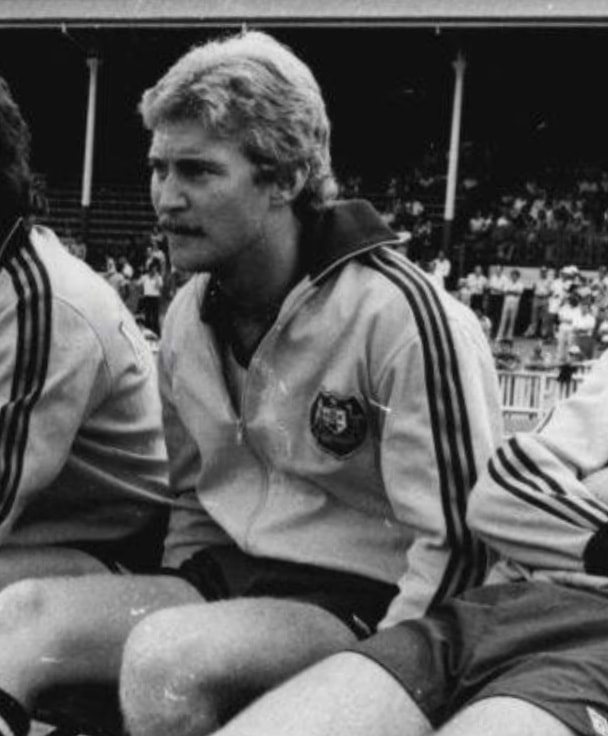 Peter Stone, Socceroo #258, seated on the pitch in his Australian national team tracksuit
